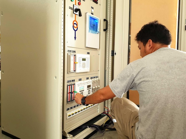 FAT for Control and protection panel, Engineer rechecks protection relay setting before testing.