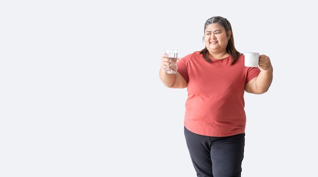 Fat woman asian happy smiling holding a glass of water and mug isolated on white background