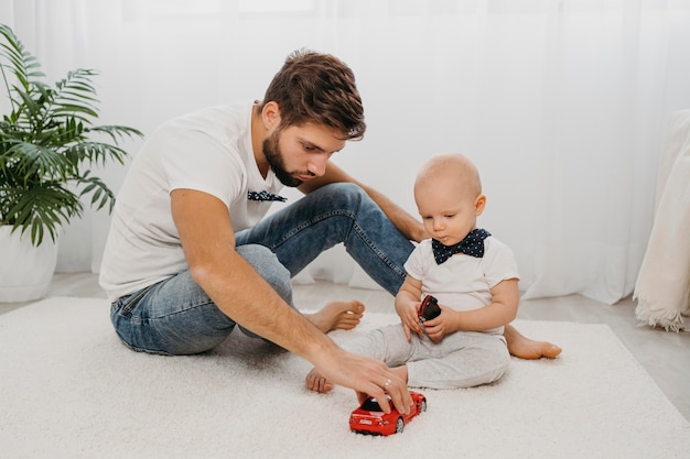 Father and baby playing together at home