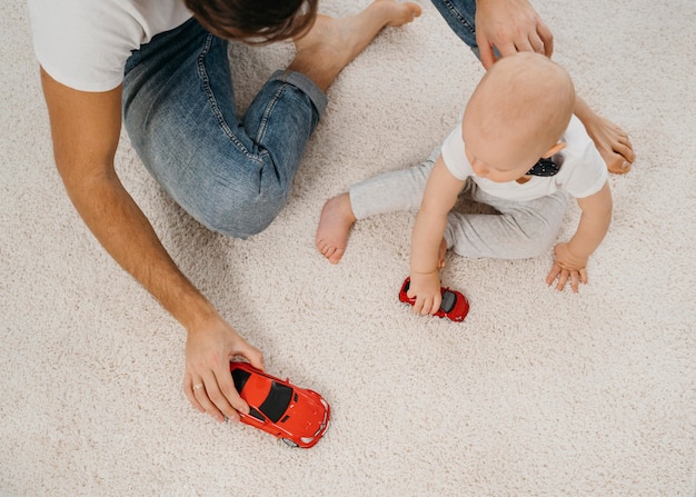 Father and baby playing together