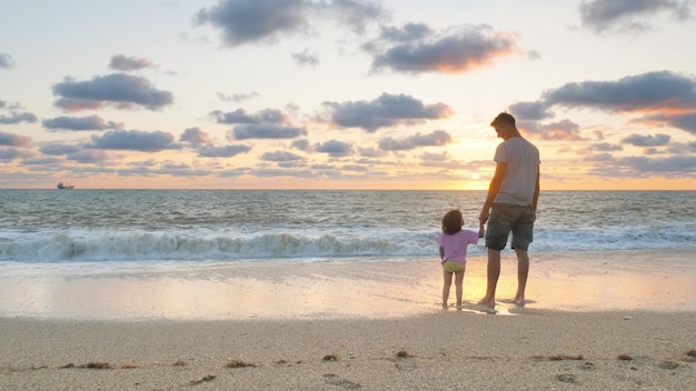 Father and daughter on the sea