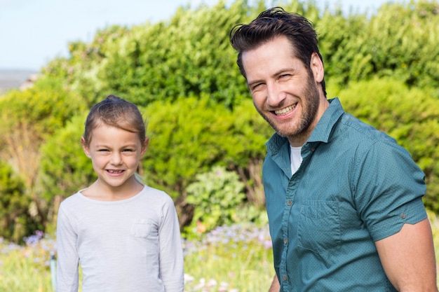 Father and daughter smiling at camera