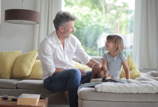 father and daughter on the sofa