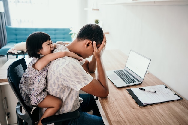 Father feels stressed interrupts by daughter while working