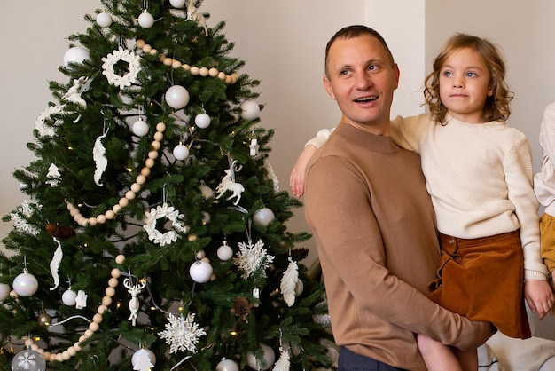 Father and his little daughter at christmas home