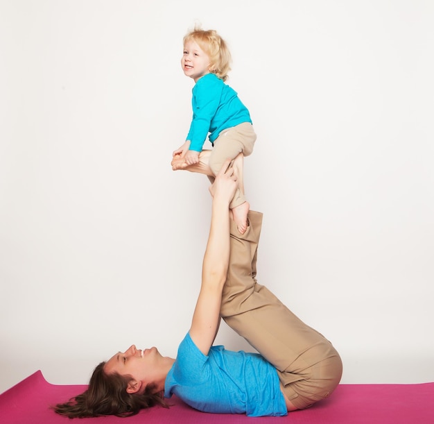 Father holding his little son on his feet