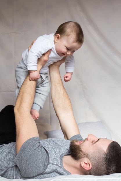 A father holding his son