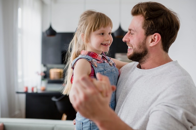 Father looking at daughter