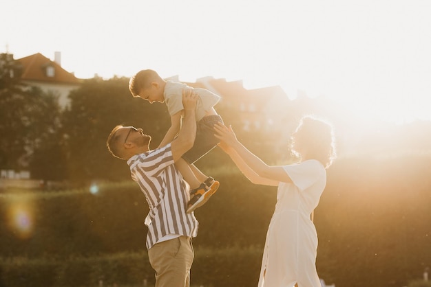 Father mother and son are having fun in an old European town Happy family