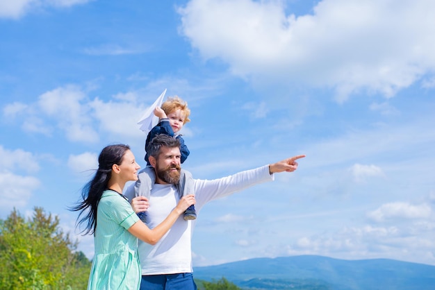 Father mother and son in the park Freedom to Dream Joyful Boy Playing With Paper Airplane