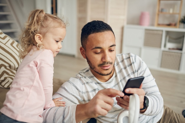 Father Showing Smartphone to Kid