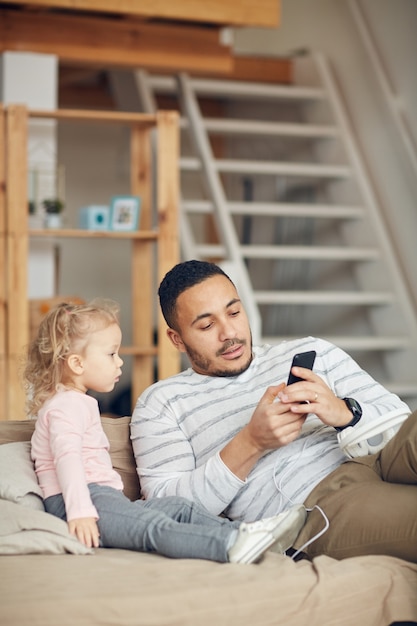 Father Showing Smartphone Videos to Kid