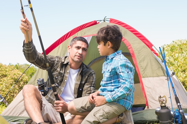 Father and son by their tent