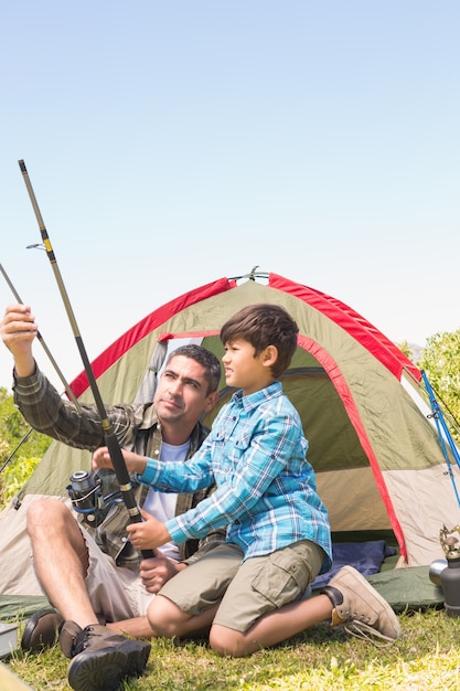 Father and son by their tent 