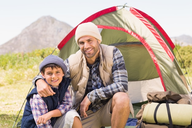 Father and son by their tent