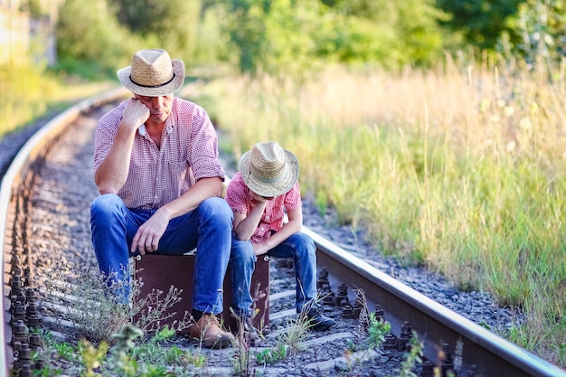 Father and son cowboys concept happiness together