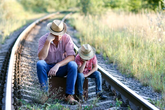 Photo father and son cowboys concept happiness together