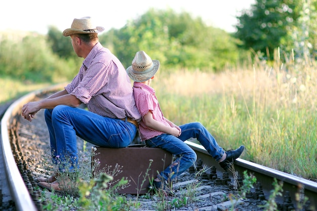 Father and son cowboys concept happiness together