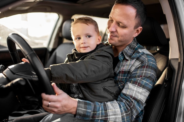 Father and son driving together