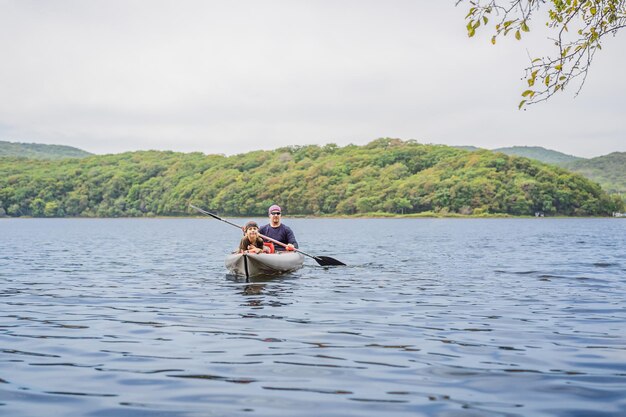 Father and son kayaking on the sea