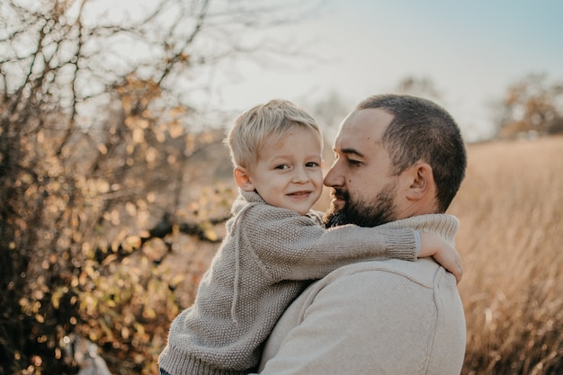 Father and son playing, having fun on the nature