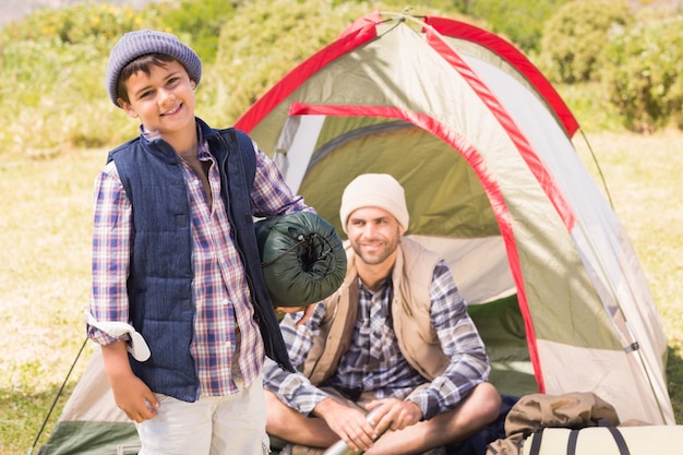 Father and son in their tent