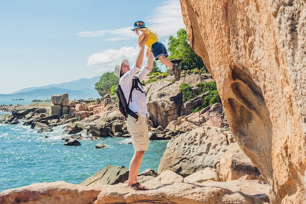 Father and son travelers at the Hon Chong cape, Garden stone, popular tourist destinations at Nha Trang. Vietnam