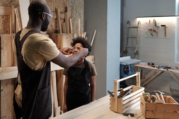 Father and son in workshop