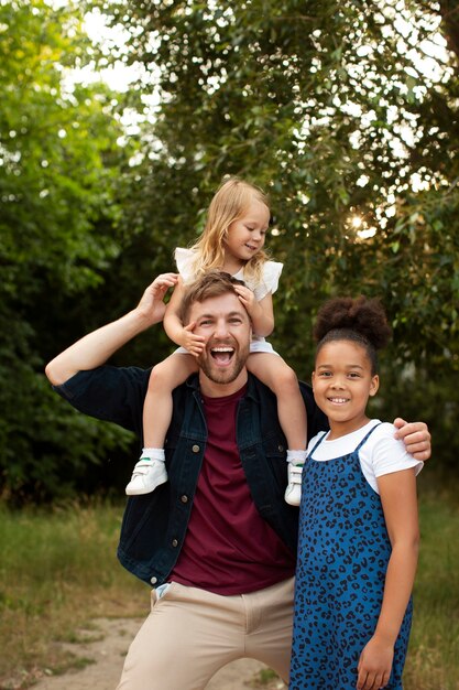 Father spending time with his adopted daughters