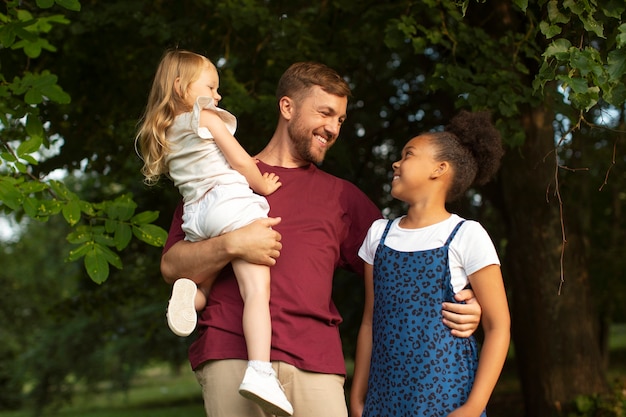 Father spending time with his adopted daughters