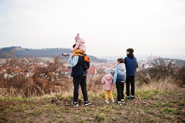 Father with children looks at the panorama of the city