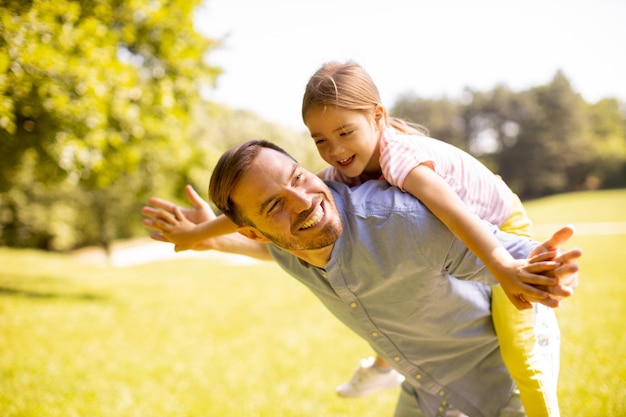 Father with daughter having fun at the park