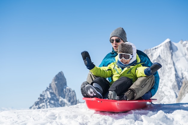 Father with son sledding