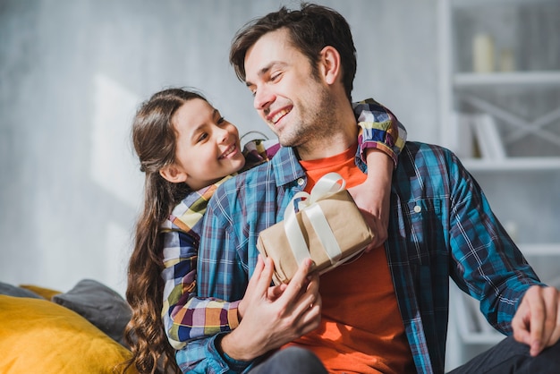 Fathers day concept with happy father and daughter