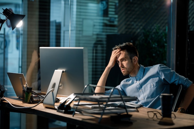 Fatigue man watching computer at work