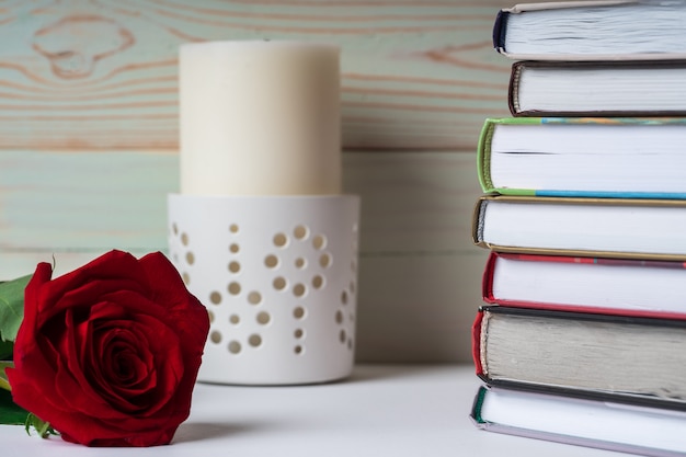 Favorite books are stacked in anticipation of reading.