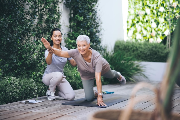 Fear of the future only ruins the present Shot of an older woman doing light floor exercises during a session with a physiotherapist outside