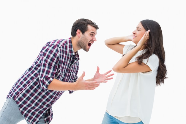 Fearful brunette being overpowered by boyfriend