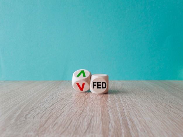 FED symbol Wooden cubes with the direction of an arrow symbolizing that the FED are going down or up