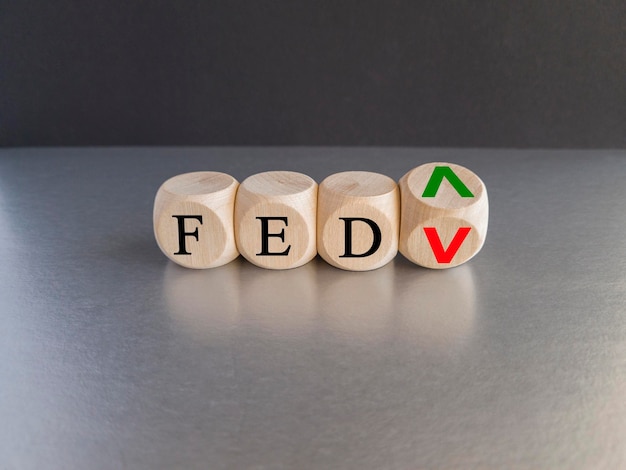 FED wording with up and down arrow on wooden cubes for Federal reserve increase