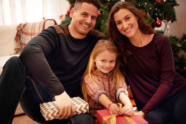 Feeling the festive cheer Portrait of a young family celebrating Christmas