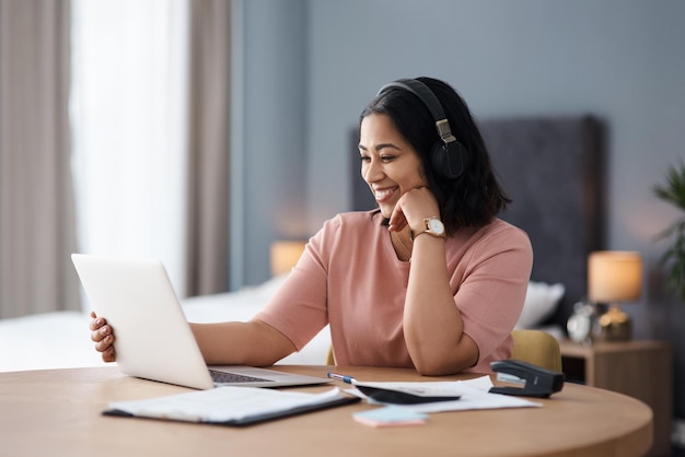 Feeling ready to take on this day Shot of a young woman working from home