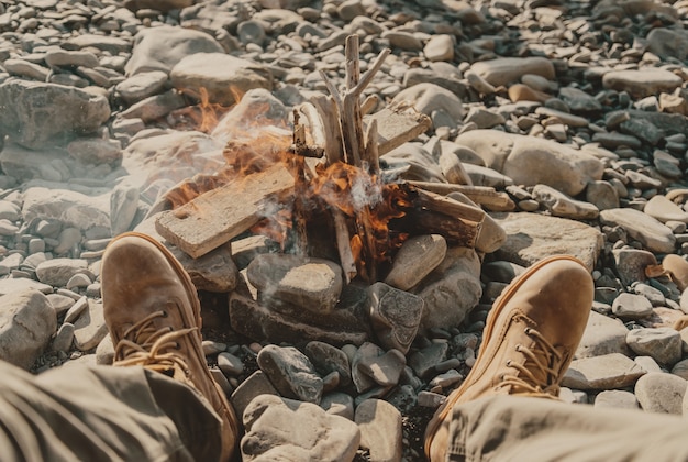 feet near the bonfire