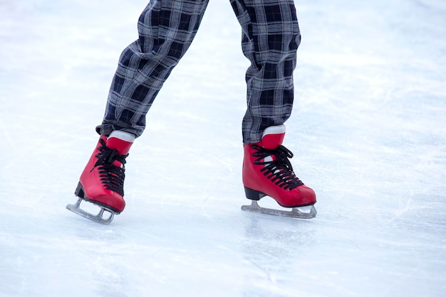 Feet on skates on an ice rink winter sport and recreation