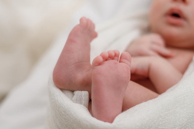 Feet of a sleeping baby closeup