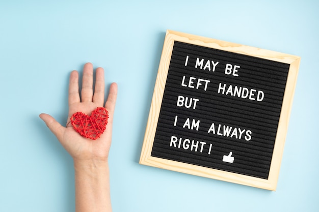 Felt board with text I may be left handed but I am always right. Left handers day concept