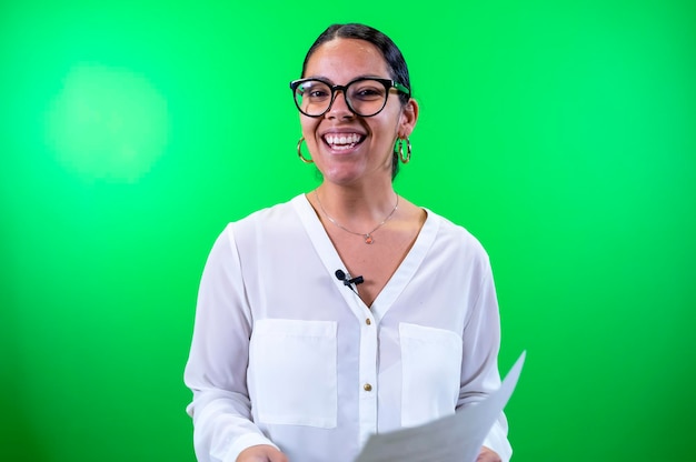 Female broadcasting host with glasses green background