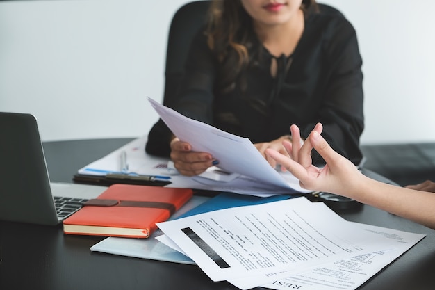 A female business consultant describes a marketing plan to set business strategies for women business owners.