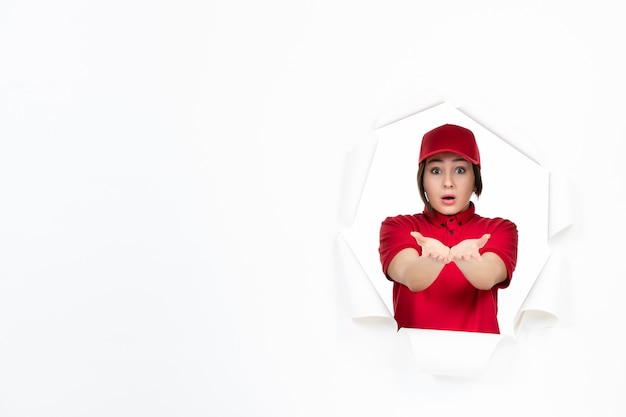 Female courier in red uniform on white