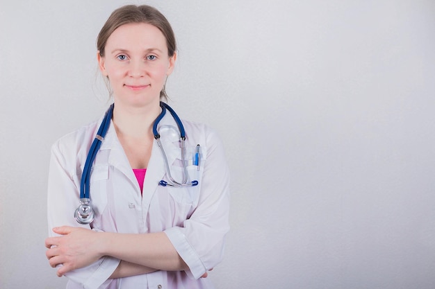 Female doctor on gray background